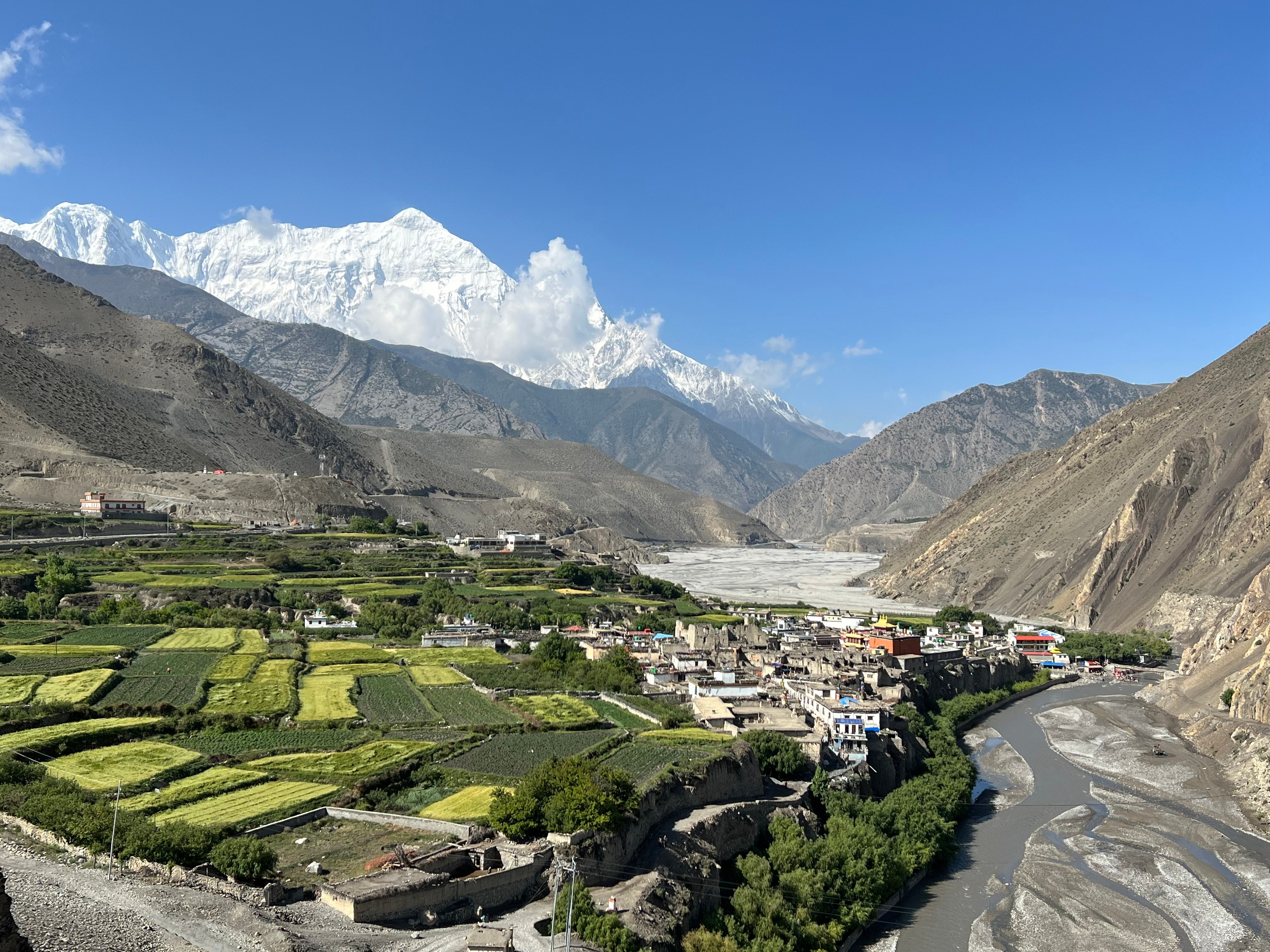  A terraced Himalayan valley below snow peaks in Nepal