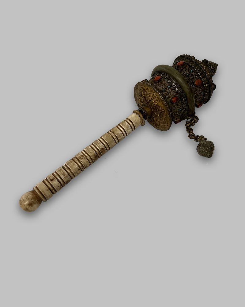 Buddhist hand held prayer wheel with gemstones and bone handle