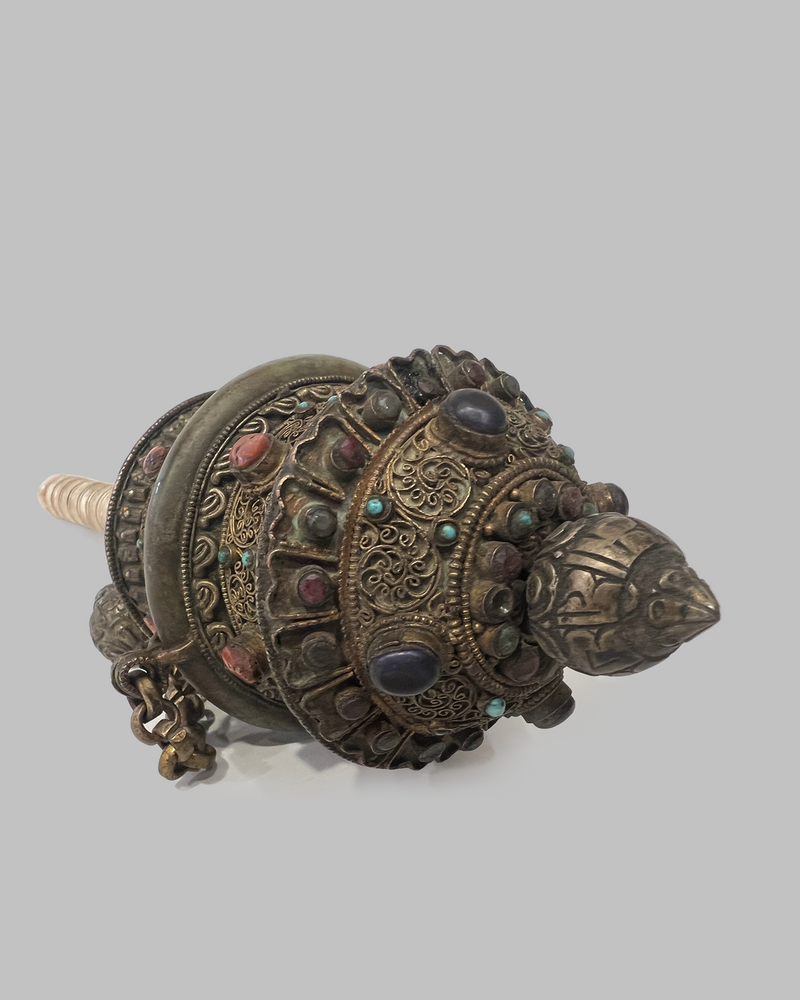 Buddhist hand held prayer wheel with gemstones and bone handle