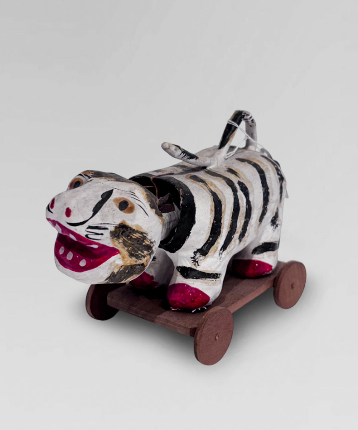 Vintage paper mache "Hariko", Japanese folk art nodding head tiger, on wheeled base.