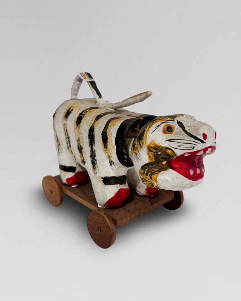 Vintage paper mache "Hariko", Japanese folk art nodding head tiger, on wheeled base.
