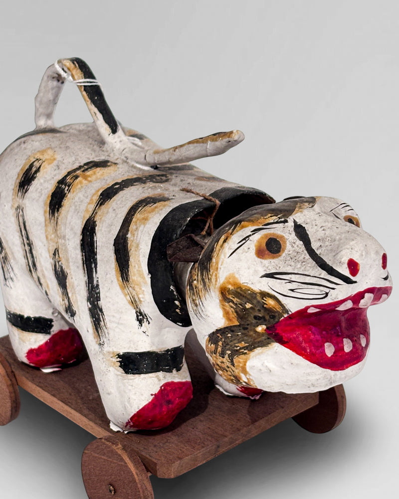 Vintage paper mache "Hariko", Japanese folk art nodding head tiger, on wheeled base.