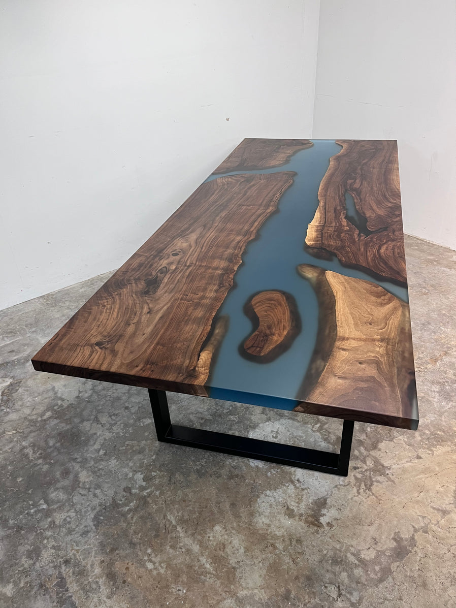 Walnut Dining Table with translucent pale turquoise epoxy river