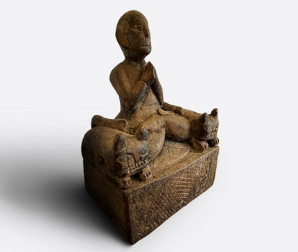 Praying figure with cat guardians, Nepal, 19th century