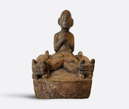 Praying figure with cat guardians, Nepal, 19th century