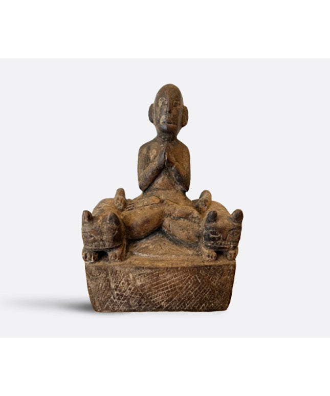 Praying figure with cat guardians, Nepal, 19th century