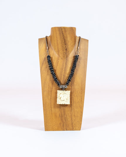 Hand Carved Bond Pendant