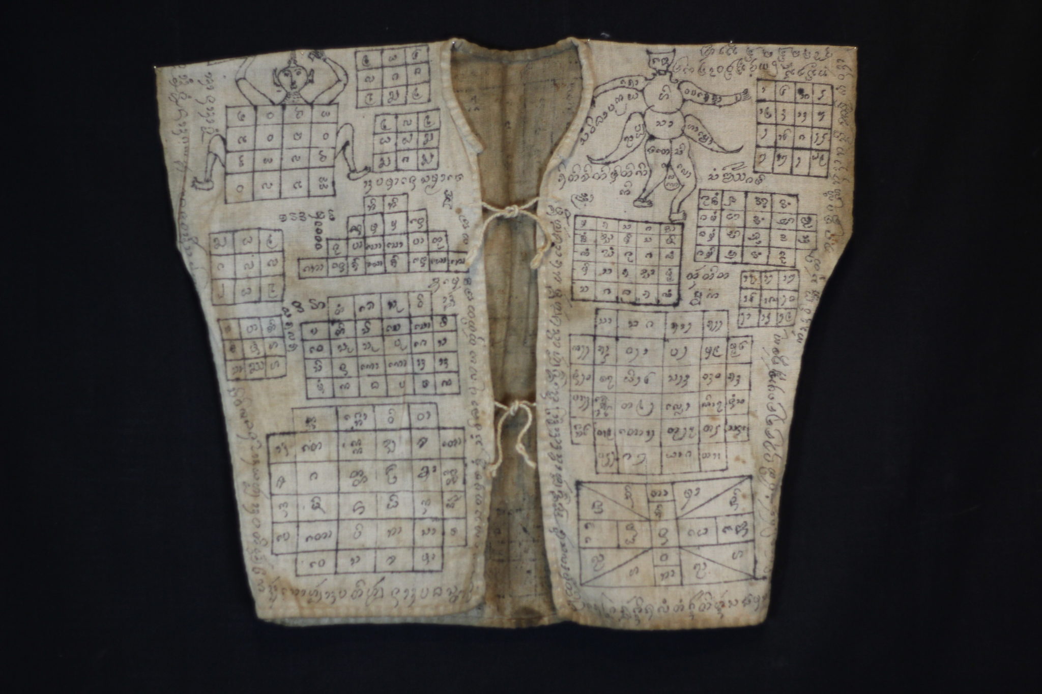 Amulet Yantra Vest Nong Pho, Thailand Vietnamese shaman Mid to late 19th c. Cotton, pigment Handmade and drawn by the shaman It is endowed with prayers, signs, numbers and a depiction of the great guru monk Luang Phor Doem. The sacred cloth is an undergarment worn as a talisman with great protective power against physical harm, like bullets, spears, knives, wild animals and evil spirits. 19” x 22” $2,900.
