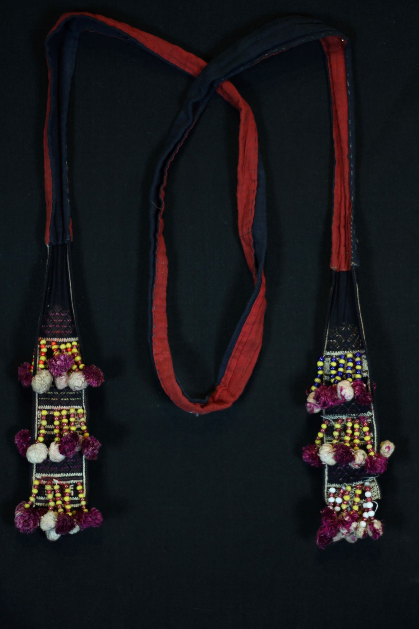 Shaman Costume Belt, Vietnam, Mid 20th c, Cotton, embroidered with silk, glass beads, Part of shaman’s costume. 69 ½” x 3” x 1”, $180