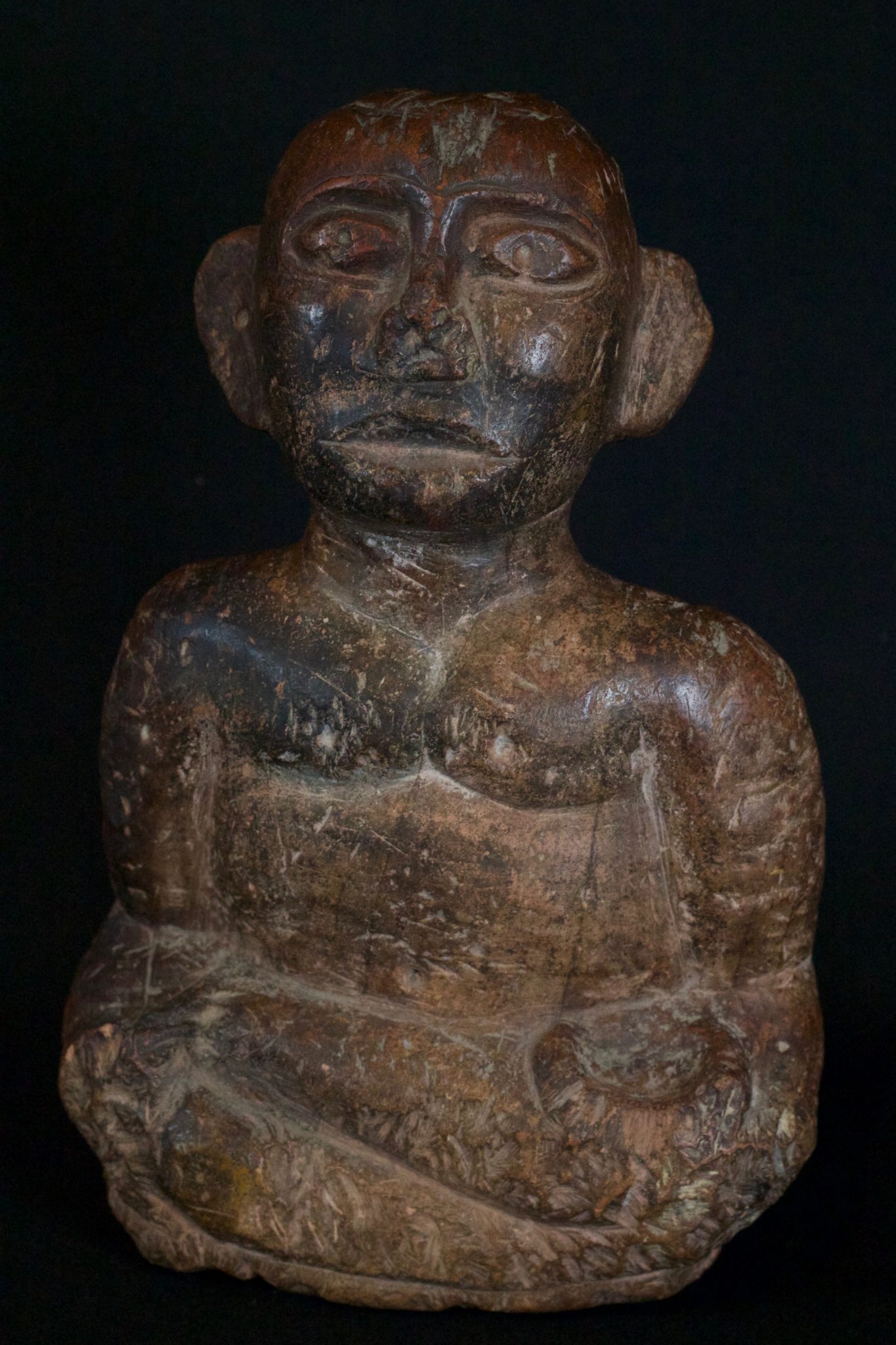 'Pangulubalang' Shaman Figure (exceptionally rare), Sumatra, Indonesia, Batak, Simalungun, Mid 16th to 17th c, Stone, with patina They are specifically made by the shaman and embodied with a powerful spirit slave. They are used in conjunction with a magical substance, pupuk - a magical substance which is the embodiment of earthly suffering, destruction, hate and anger - which required special ingredients and a long and intricate preparation ritual. The purpose of this was to imbue the statue with the power to ward off evil spirits, to prevent disasters and as a dynamic healing tool. For healing, small bits of the statue itself were chipped off of corresponding body parts and made into a potion. 12” x 7 ¾” x 3 ½”, Price on request