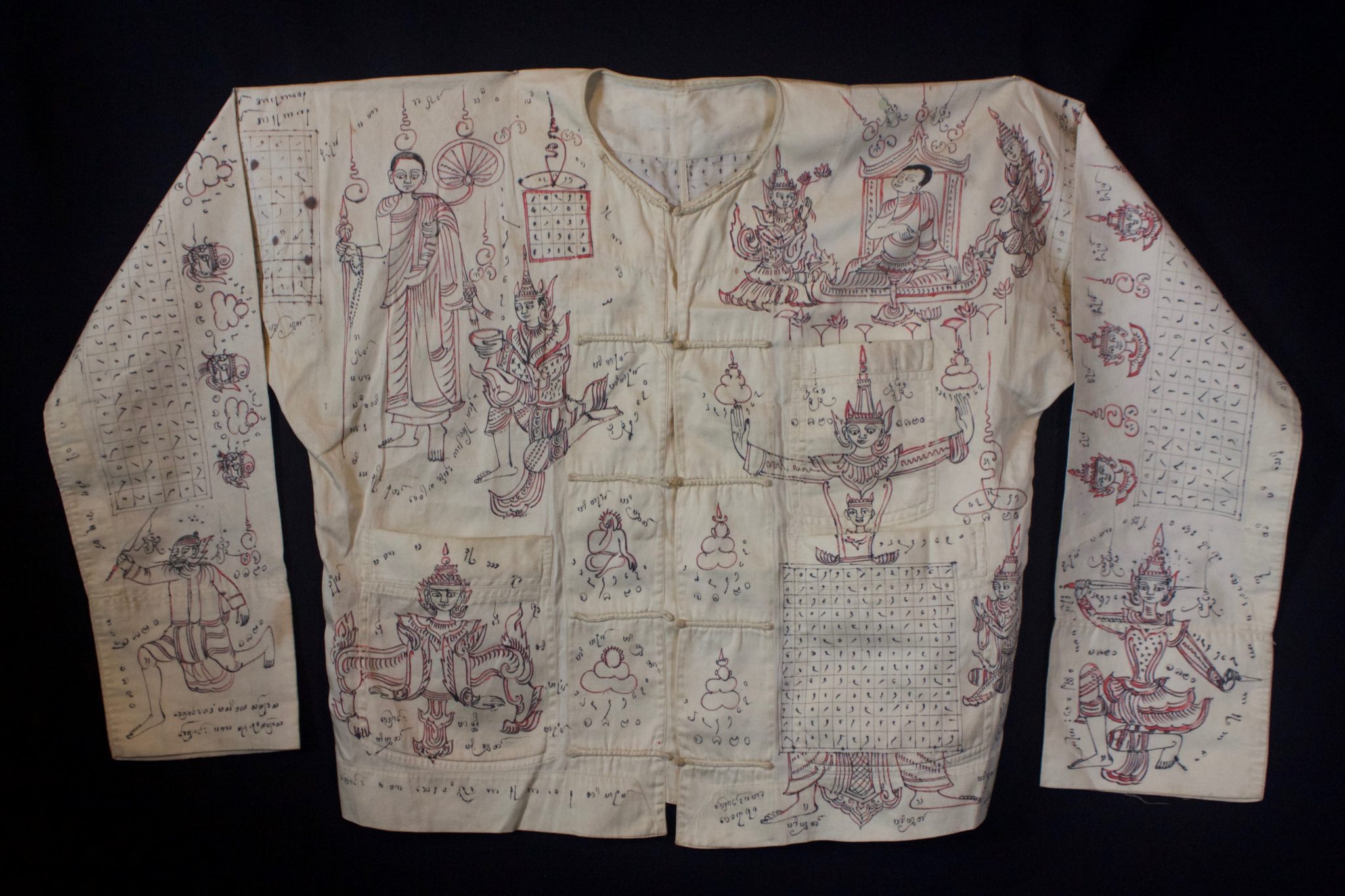 Amulet Yantra Shirt - extremely rare and powerful protective garment Thailand Vietnamese tribal shaman Mid 20th c. Cotton, ink, pigment Handmade and drawn by the shaman, it depicts prayers, signs, numbers and a deities. The sacred cloth is an undergarment worn as a talisman with great protective power against physical harm, like bullets, spears, knives, wild animals and evil spirits. This one may have been commissioned by a wealthy man who felt he needed protection. Soldiers would also wear these if they could afford one. 21” x 61” $2900