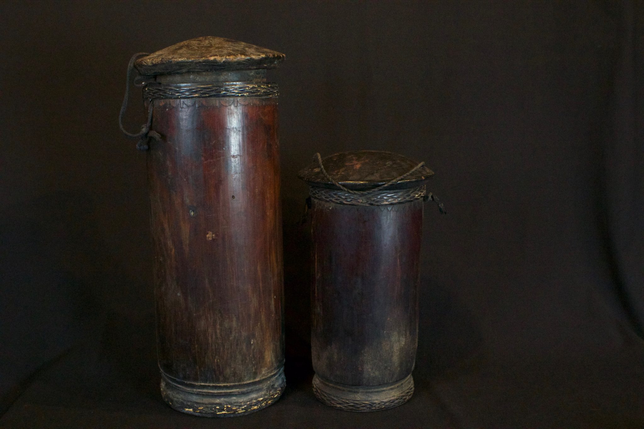 Shaman's Medicine Container, Sumatra, Indonesia, Batak tribe, Early 20th c, Wood, rattan, fiber cord, pigmented. Hung in a shaman’s home to store medicines. (left/large - 17” x 7 ¼” x 7 ¼”, $475.); (right/small -12” x 6 ¼” 6 ¼”, $375.)