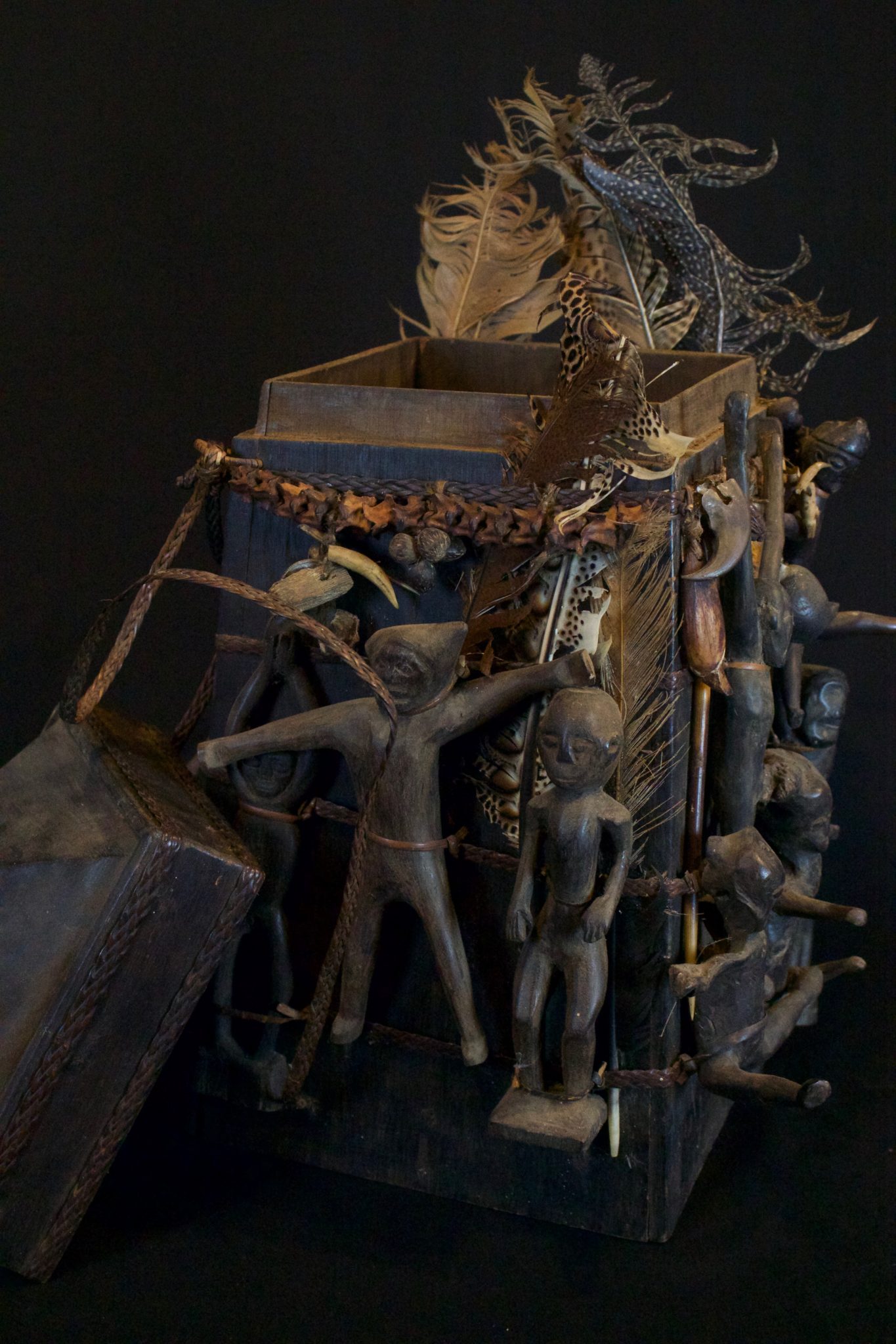 'Lupong Manang' Shaman’s Medicine Carrier/Backpack with Healing Charm Figures (rare), East Kalimantan, Borneo, Indonesia, Dayak tribe. Late 19th to early 20th c, Wood, braided reed, feathers. The Shaman made his own medicine kit to contain items for healing, protections and predictions – such as special teeth, stones and other items. The figures on the exterior correspond to illnesses and other conditions or ailments. 17 ½” x 13” x 13”, $4800.