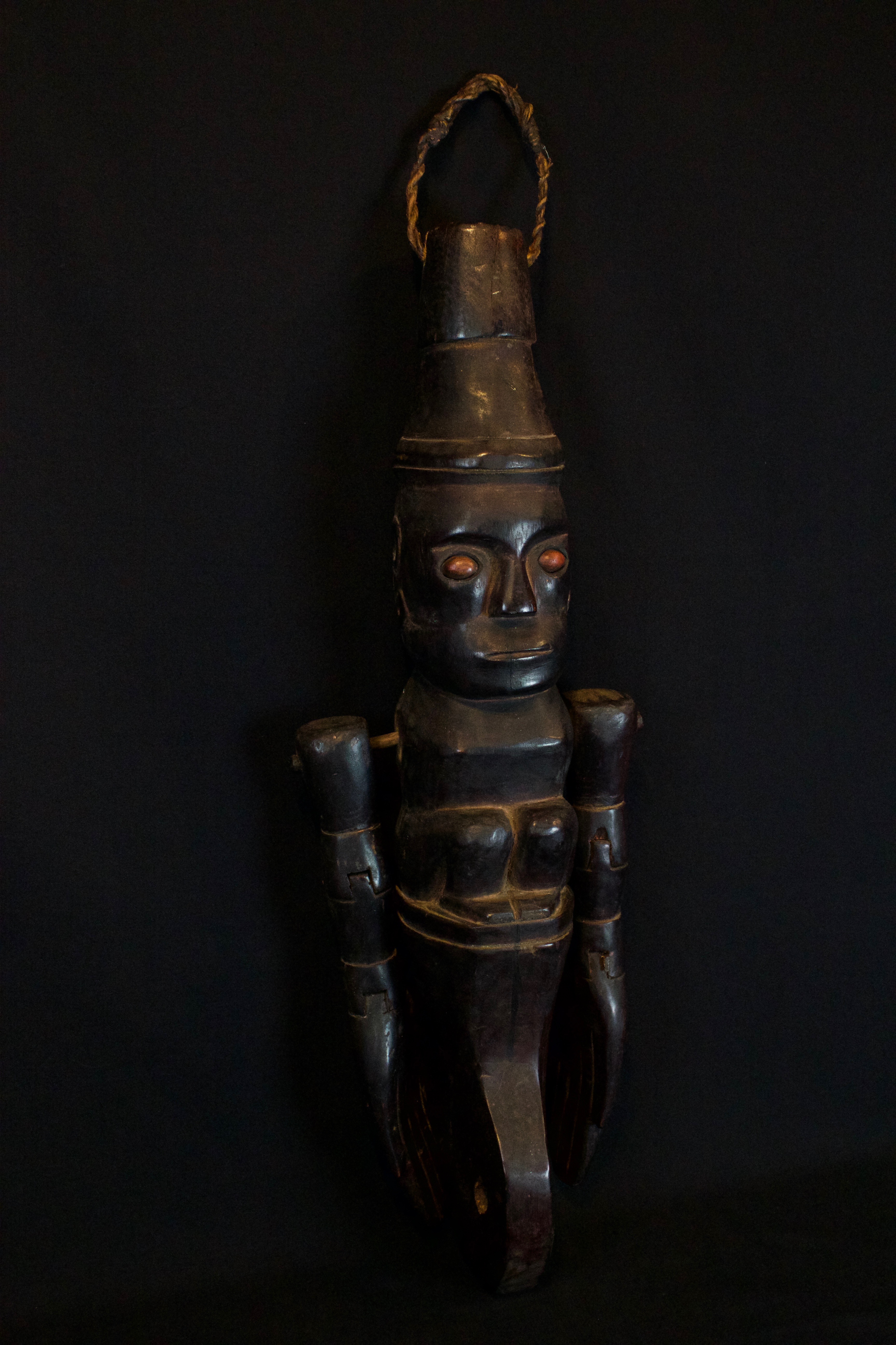 Shaman Divining Effigy, Sumatra, Indonesia, Karo village, Batak tribe, Late 19th c, Wood, pigment, fiber cord, smooth patina from use and age. Used to predict the future. 20” x 9” x 6”, $1450.