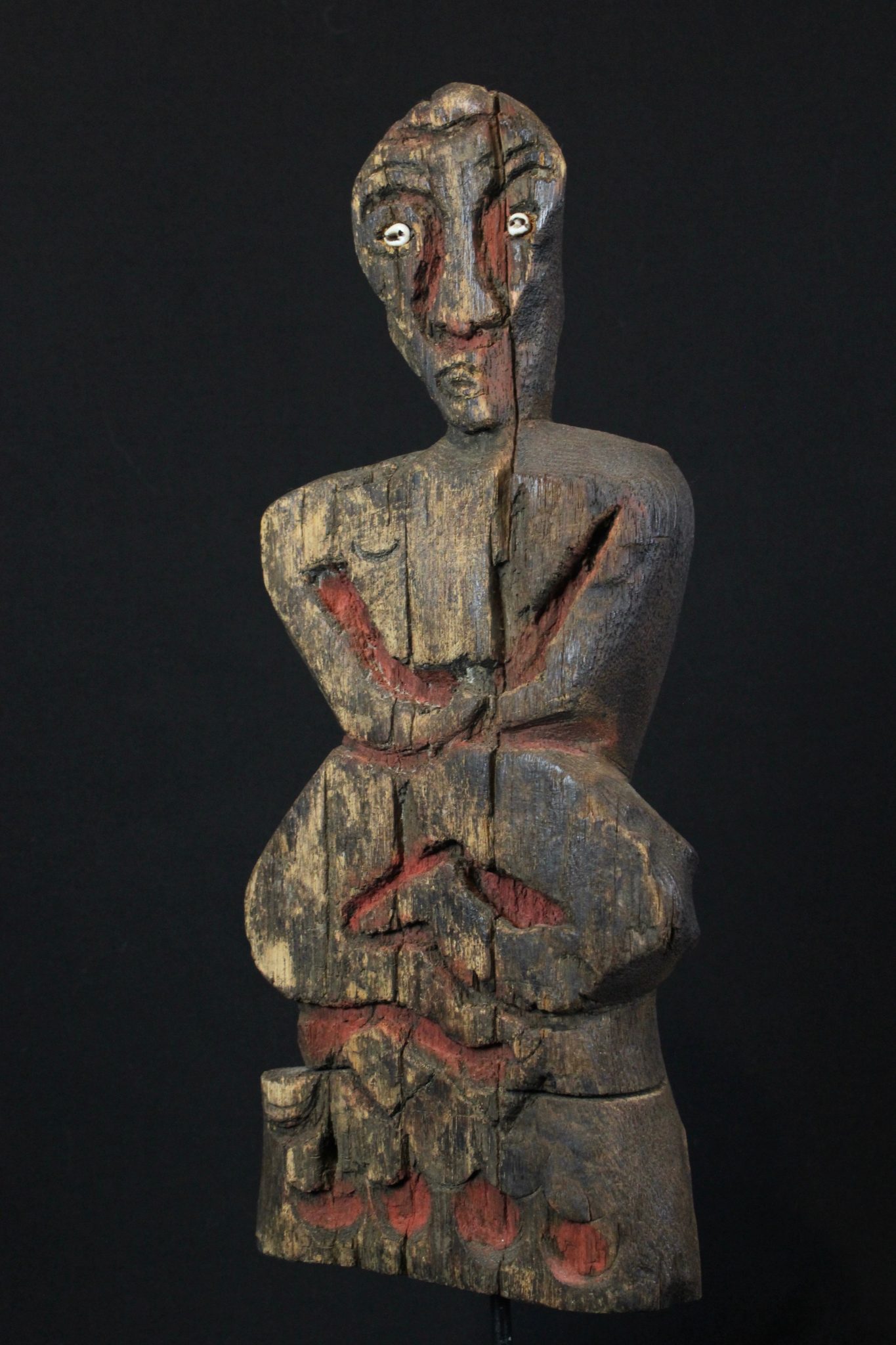 Shaman Effigy Figure, Nagaland, India, Naga tribe, Early 20th c, Wood, pigment, shell, Probably for calling spirits as well as for use in healing rituals There are 7 images on the back of creatures made by poking holes as an outline for each one. 14” x 5 ¾” x 2 ¾”, Sold
