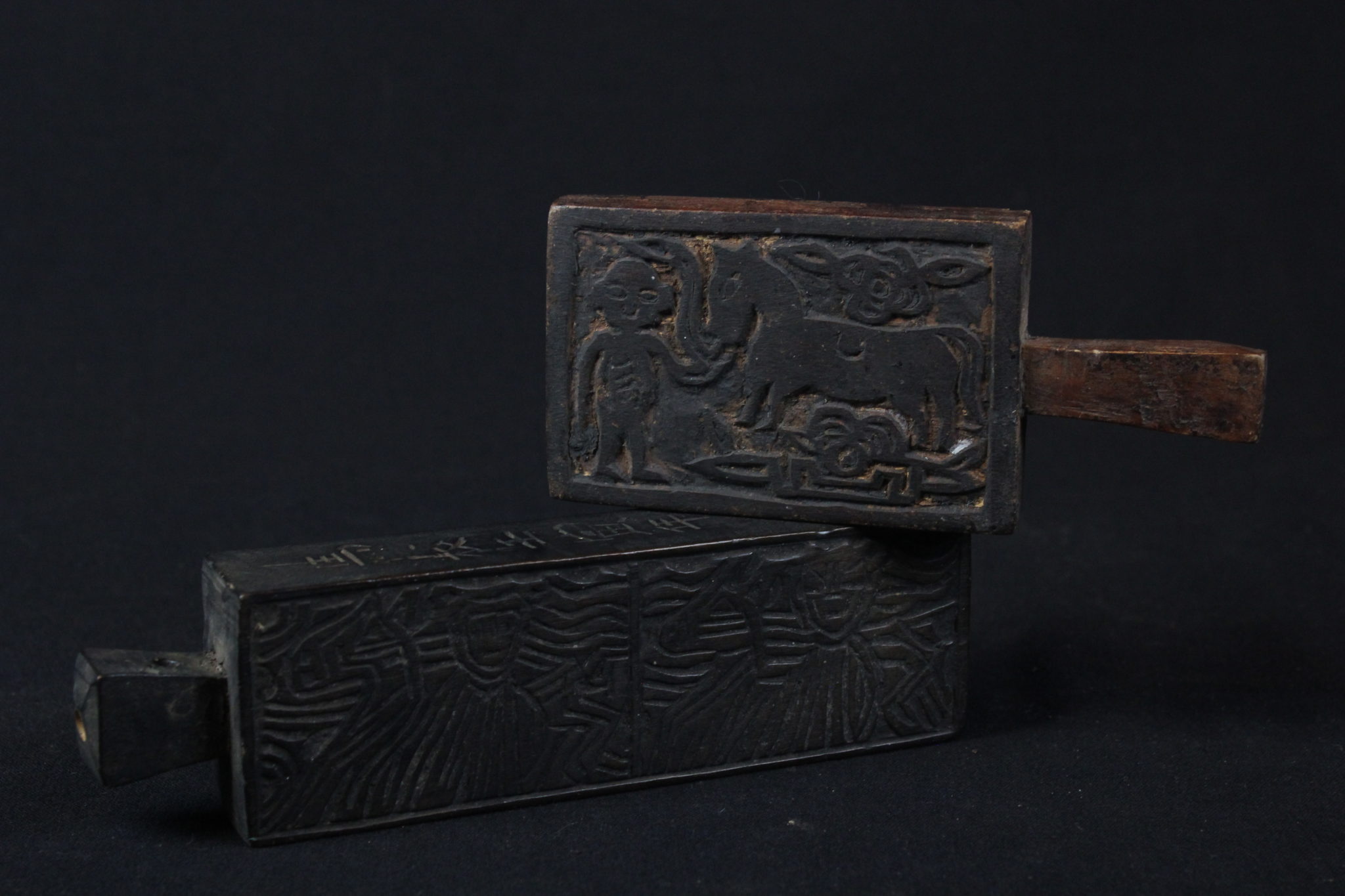 Shaman Printing Block, Tuyen Quang province, Vietnam, Mid 20th c, Printing blocks are important shaman tools for creating talismans and ghost money to burn as offerings to deities. They were stamped on paper or on envelopes to mark the contents as holy. (Top - 2 ¼” x ½’ x 5’, $110.); (Bottom, 1 ¾” x 6 ¼” x 1”, $90.)