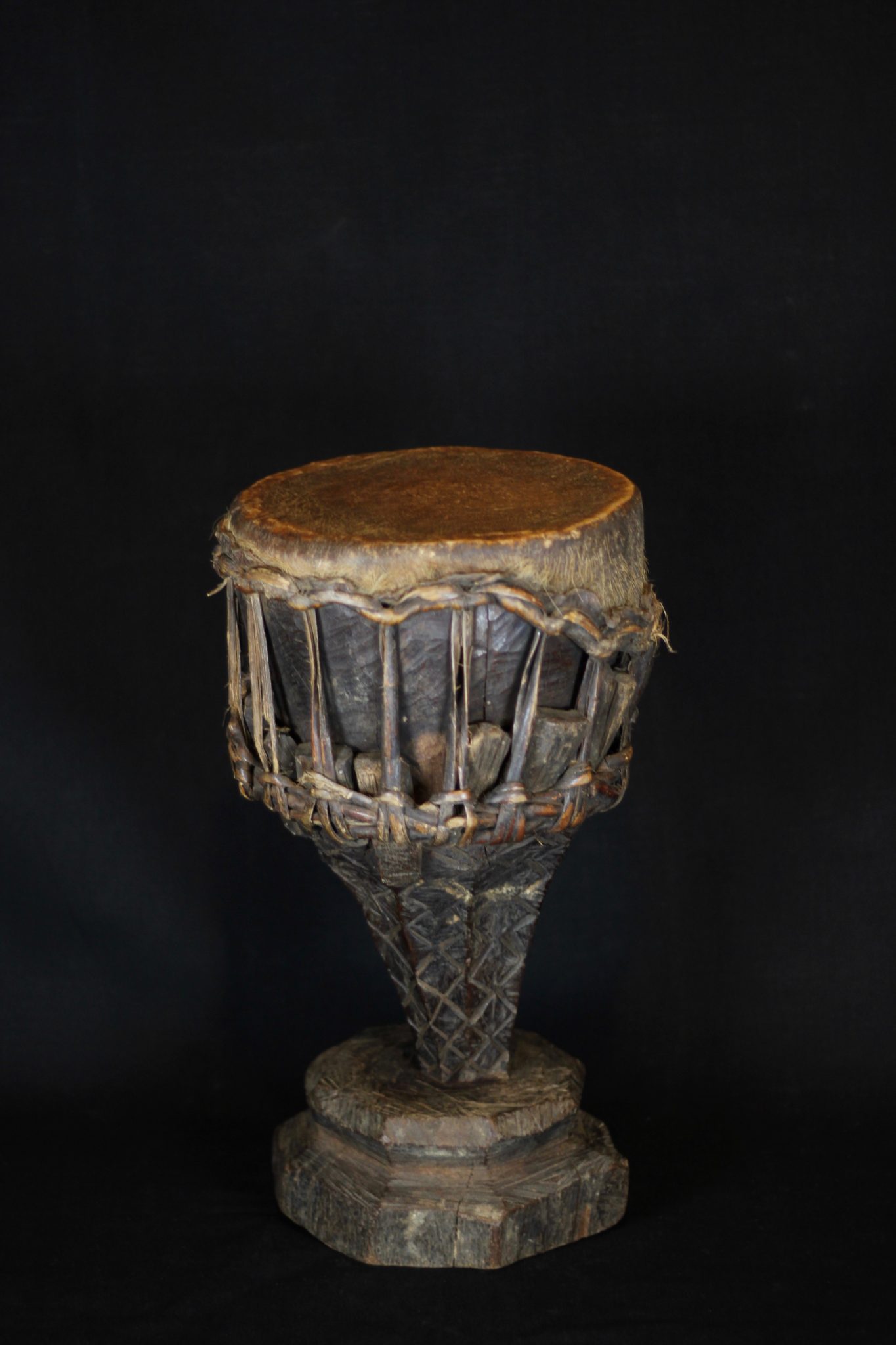 Shaman Drum, Sumba Island, Indonesia, Early to mid 20th c, Animal skin stretched over wood, Used by shaman to initiate and maintain a trance state during rituals, 17 ½” x 10 ½’ x 10”, $490.