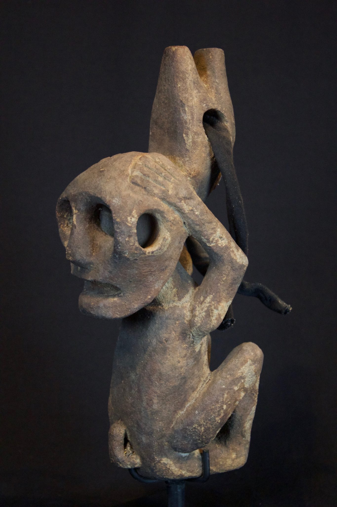 Shaman Figure, Central Flores Island, Lesser Sunda Islands, Indonesia Island, Japu village, Early 20th c, Stone, cloth strap. For protecting the clan house and for divination, 11” x 3 ½” x 5 ½”, $800.