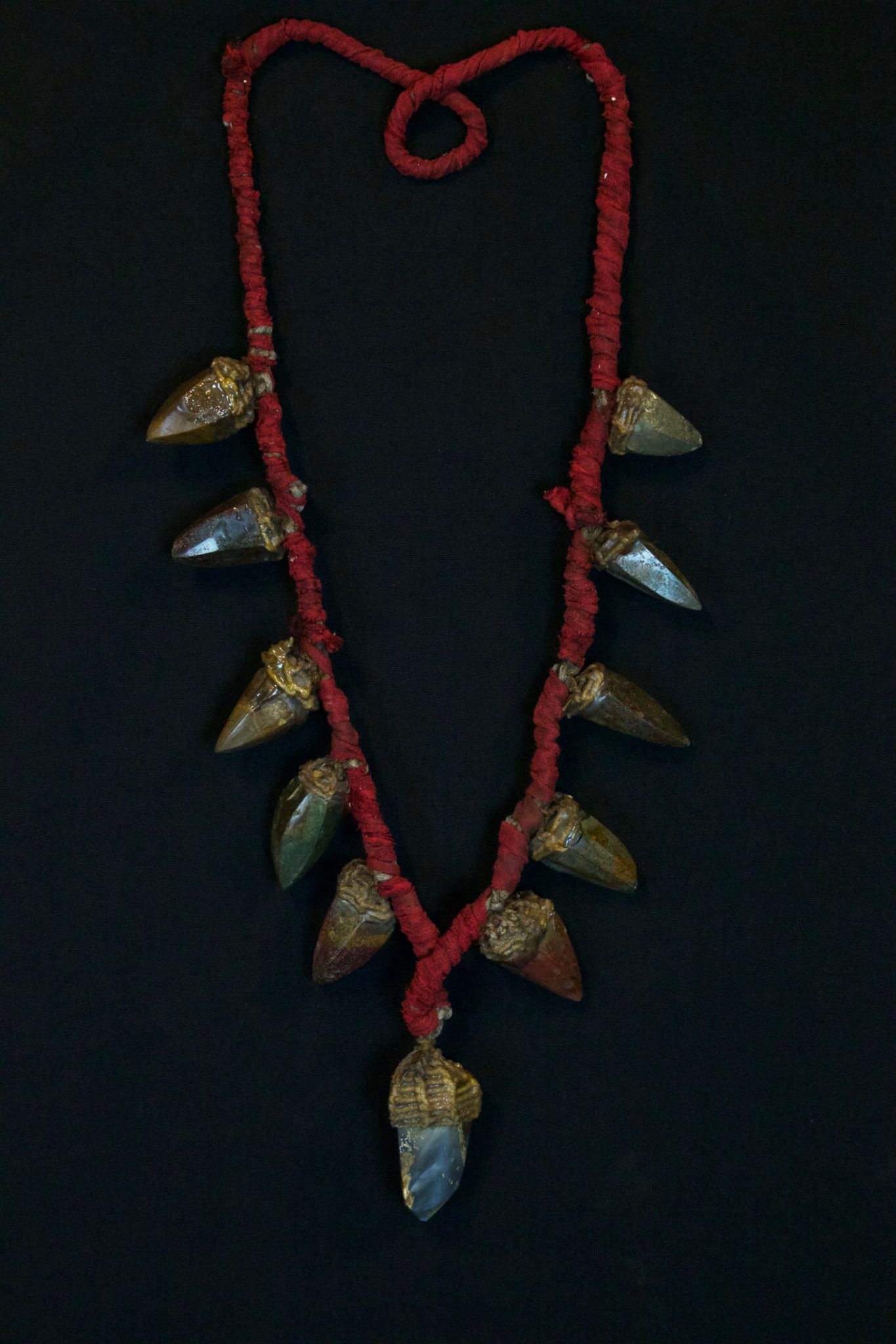 Shaman Healing Stones Necklace, Papua, New Guinea (Irian Jaya), Indonesia, Early to mid 20th c, Stone, Shells, cloth fiber cord. Used in healing ceremonies. 18” x 5” x 1”, $550.