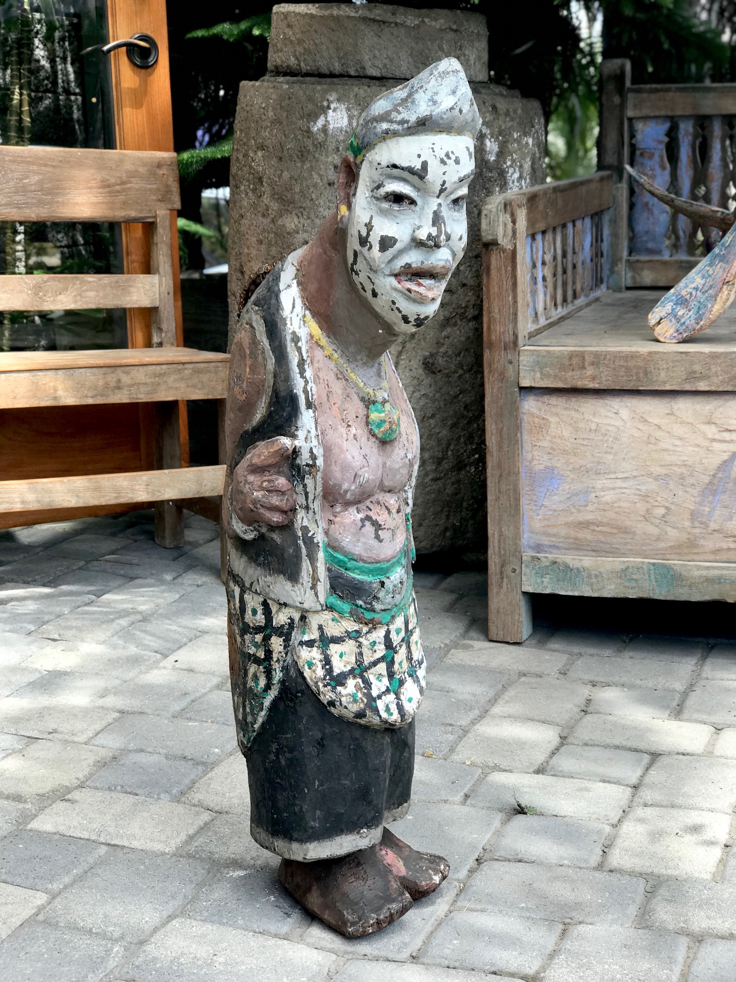 Tribal Musical Instrument, Slit Drum/Gong, depicting Semar and important Javanese God/clown, Indonesia, wood, paint, bicycle chain handle, This type of percussion instrument was developed and used by people in forested areas as its sound will carry far through the surrounding jungle and rice fields. Often hung or placed in a drum pavilion or tower and used to call villagers to meetings, or other events by tapping out a signal. 36" x 10" x 12", $750., thedavidalancollection.com , solana beach, ca