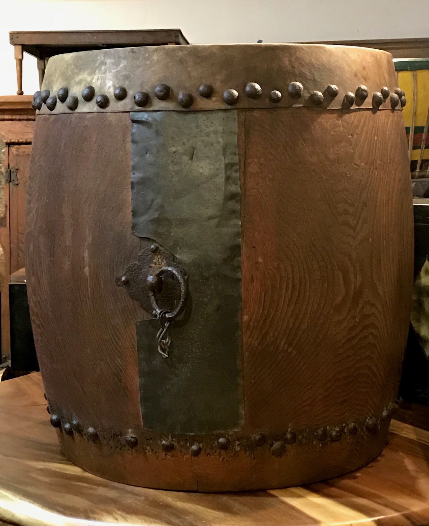 Musical Instrument, Edo period Taiko Buddhist Drum, Japan, 18th c, keyaki wood (Japanese red elm), metal panel on side, metal tacks on rawhide skin (missing center of drum head skin on both sides) Metal ring with rope for carrying, 29 1/2" x 34", $2800. thedavidalancollection.com , solana beach, ca