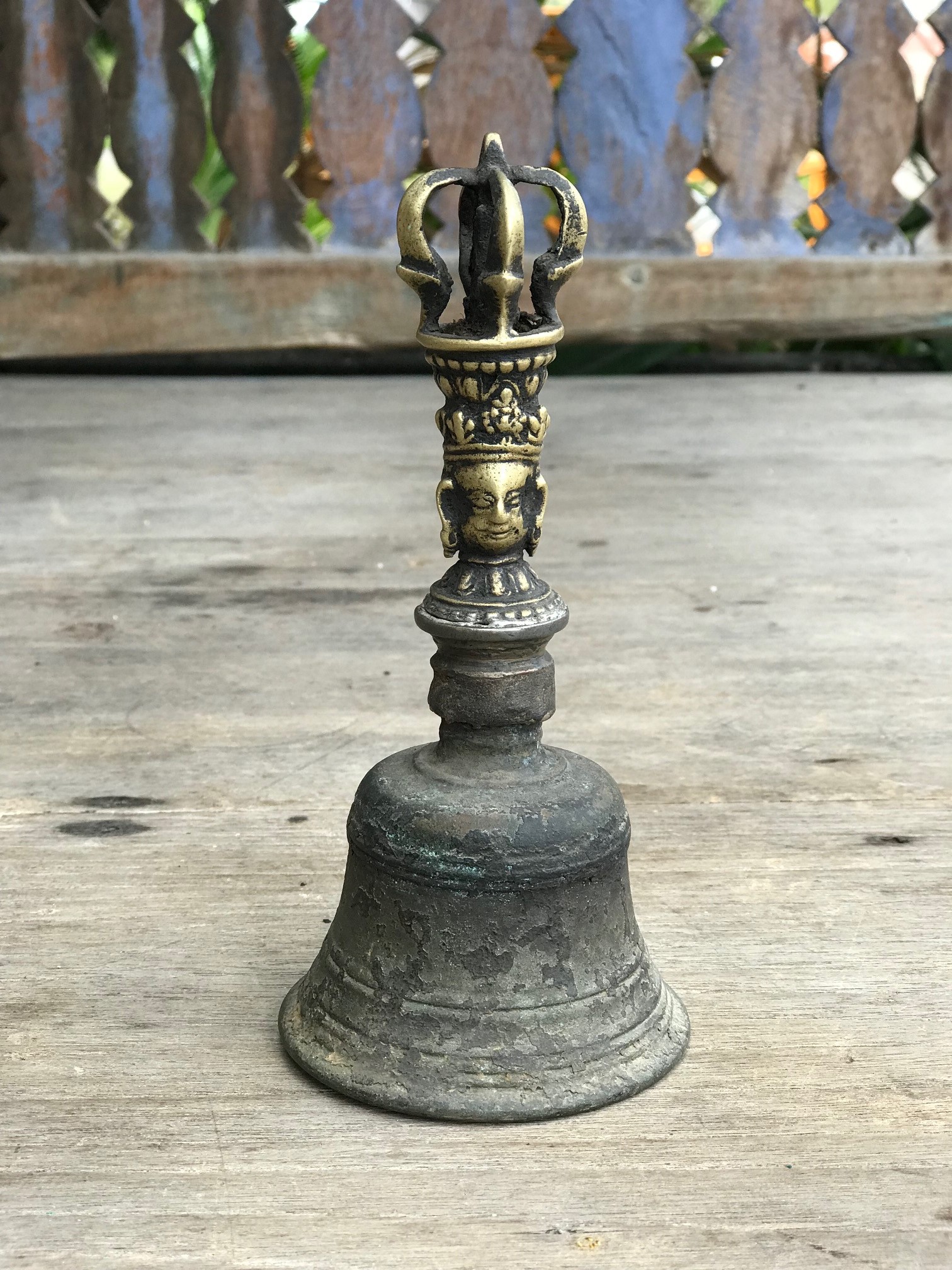Musical Instrument, temple clapper bell with face, Nepal, 150 years old, bronze, The Bell, representing the female aspect, stands for wisdom. It is held in the left hand. If the Dorje (crown motif on top) is separate, it is held in the right hand. The are always used in combination in religious ceremonies. Together they represent enlightenment. 7 1/4" x 3 1/4", $1300. thedavidalancollection.com , solana beach, ca
