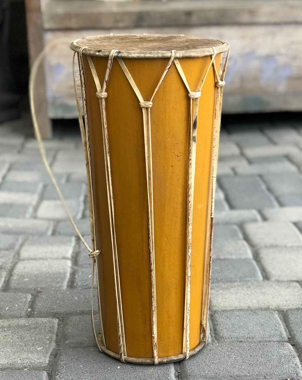 Double Headed Drum, Java, Indonesia, hide skin heads with hide lacing and tuning straps. wood and paint with metal rings for carrying strap, contemporary, 21" x 10" (top) x 7 3/4" (bottom); $440. ; thedavidalancollection.com , solana beach, ca