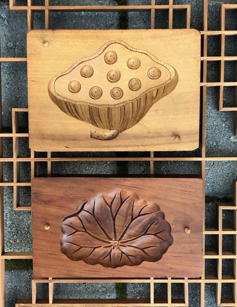 Vintage Japanese Kashigata: Traditional Wooden Confectionery Molds Little cakes (Higashi) are made individually for tea ceremonies, events and shrine offerings. They are shaped into objects of art and symbolism using hand carved wooden molds called Kashigata. The rice flour and sugar confections have been a popular tradition for more than 300 years. Like many centuries old Japanese craft traditions, kashigata carving is a fading art. Now there is only rare demand for the specialty cakes. The artizanal sweet molds have joined the ranks of rapidly dissapearing objects of times past. The beautiful confectionery tools are now sought after as collectable wood carvings. The mold making process begings with preparing the wood - most commonly Mountain Cherry, Ginko, and Camllia, which is cured for three years before carving. And for generations, kashigata craftsmen have produced an extensive range of imagery and symbolism that imparts the spirit of the carver and the mystery of natural and supernatural symbolism, into a tradition of handmade, delicate Japanese sweets. Specialty molded cakes are a part of a confectionery culture found around the world - for example: Mexican ‘Sugar Skulls’, French ‘Madeleines’, Scottish ‘Shortbread’, Russian ‘Oreshki’, and Middle Eastern ‘Ma’amoul’.